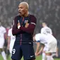 Kylian Mbappe melakukan selebrasi usai mencetak gol ke gawang Caen pada lanjutan pertandingan Ligue 1 di Stadion Raymond-Kopa, di Angers, Prancis (20/12). Sebelumnya rambut MBappe berwarna hitam. (AFP Photo/Franck Fife)