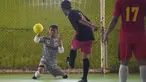 Seorang kiper, Eman Sulaeman berusaha menangkap bola saat pertandingan futsal di Indramayu, Jawa Barat, 3 Februari 2018. Pada 2016 lalu, Eman mengikuti Homeless World Cup di Glasgow dan dinobatkan sebagai kiper terbaik dalam ajang itu. (ADEK BERRY/AFP)