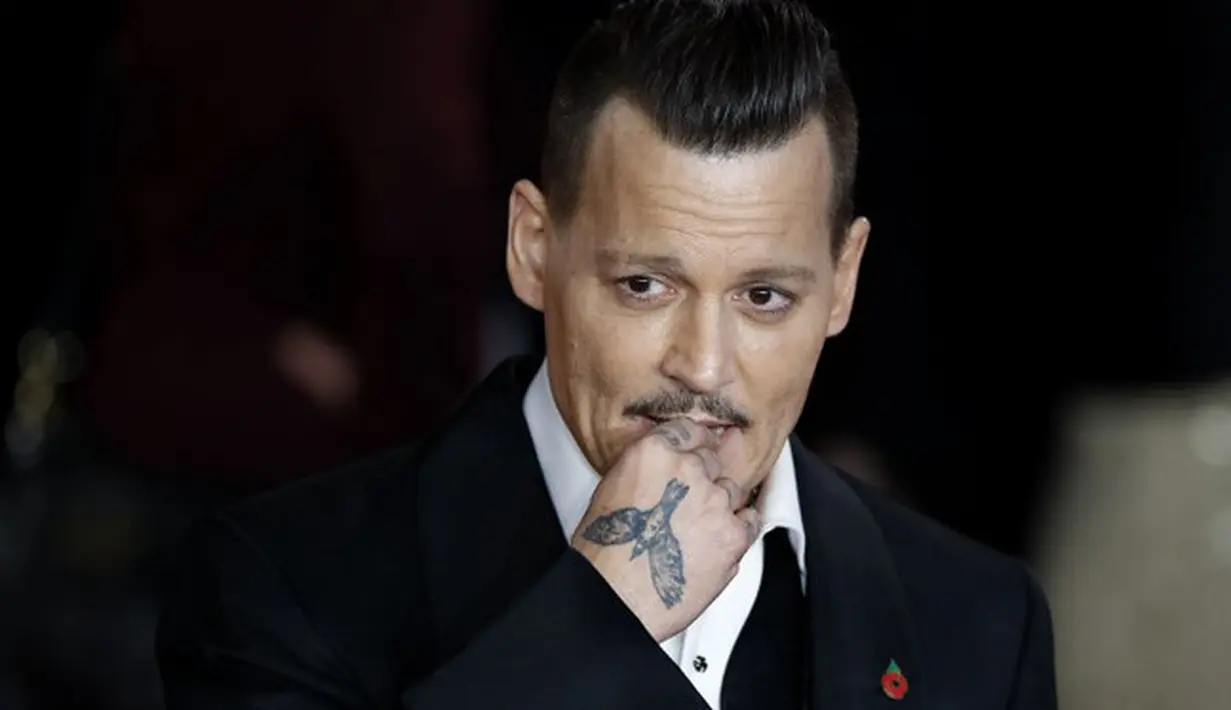 Baru-baru ini kehidupan Johnny Depp bisa dibilang mengalami banyak perubahan. Terlebih saat dirinya berpisah dengan sang istri, Amber Heard. Hal ini berpengaruh terhadap kondisi perekonomiannya. (AFP/Tolga Akmen)