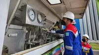 PT Pertagas Niaga (PTGN), Subholding Gas menyuplai LNG perdana bagi industri di Kota Bontang, tepatnya ke PT Energi Unggul Persada (EUP) yang bergerak dalam bidang pengolahan minyak kelapa sawit. (Dok Pertamina)