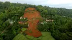 Foto udara menunjukkan kerusakan akibat longsor di Nganjuk, Jawa Timur, Senin (15/2/2021). Badan Nasional Penanggulangan Bencana (BNPB) menyampaikan bahwa tanah longsor di Nganjuk pada Minggu (14/2/2021) malam sekitar pukul 18.30 WIB dipicu hujan intensitas sedang hingga tinggi. (HANDOUT/BNPB/AFP)
