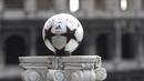Rome's Finale', the official match ball for the 2009 UEFA Champions League's final is displayed on March 16, 2009 in front of the Colosseum in Rome. AFP PHOTO / FILIPPO MONTEFORTE 