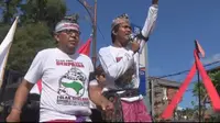 Unjuk rasa menolak reklamasi Teluk Benoa yang digelar di Denpasar, Bali, Minggu (22/5/2016). (Liputan6.com/Dewi Divianta)