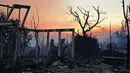 Salah satu wilayah yang paling terdampak adalah Pacific Palisades, sebuah kawasan permukiman mewah. Di sana, kobaran api menghanguskan hampir 12.000 hektar lahan. (AGUSTIN PAULLIER/AFP)
