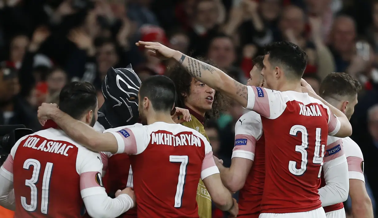 4. Black Panther (Arsenal) - Pada leg kedua babak 16 besar Liga Europa Aubameyang melakukan selebrasi ala Black Panther saat menjebol gawang Rennes. Selebrasi tersebut dilakukan pada gol kedua Auba. (AFP/Ian Kington)