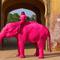 Foto gajah pink bersama model hasil jepretan fotografer Rusia di sebuah kuil di Jaipur, Rajashtan, India, yang menimbulkan kontroversi. (dok. Tangkapan Instagram @julia.buruleva/https://www.instagram.com/p/DU3ucU0kkyi/?img_index=4/Dinny Mutiah)
