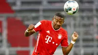 David Alaba - Jebolan akademi Bayern Munchen ini sukses mempersembahkan treble sebanyak dua kali untuk Die Roten. Pemain berkebangsaan Austria itu menjadi andalan sekaligus kunci di sektor kiri lini pertahanan. (AFP/Pool/Kai Pfaffenceach)