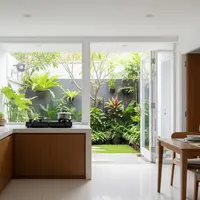 Dapur Terbuka Minimalis Anti Cipratan Minyak yang Dinding Terjaga Kebersihannya Model Menyatu dengan Taman Belakang (Image generated by AI)