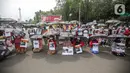 Sejumlah pekerja rumah tangga (PRT) menggelar aksi di depan Taman Aspirasi Monas, Jakarta, Rabu (21/12/2022). Aksi tersebut dilakukan untuk memperingati Hari Ibu serta meminta pemerintah untuk mengesahkan Rancangan Undang-Undang Perlindungan Pekerja Rumah Tangga (RUU PPRT). (Liputan6.com/Faizal Fanani)