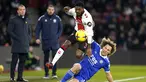 Gelandang Southampton, Ainsley Maitland-Niles berebut bola dengan bek Leicester City Wout Faes pada pekan ke-26 Liga Premier League Inggris di St. Mary's Stadium, Southampton, Minggu (5/3/2023) dini hari WIB.  Leicester keok 0-1 di markas Southampton. (Andrew Matthews/PA via AP)
