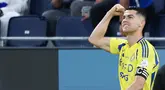 Cristiano Ronaldo kembali menunjukkan ketajamannya dengan memborong dua gol dalam kemenangan Al-Nassr atas Al-Hilal di Liga Arab Saudi, Sabtu (5/4/2025). (AFP/Fayez Nureldine)