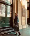 Motif dress yang dipadu padankan dengan leather jacket bewarna hitam. (instagram/septriasaacha)