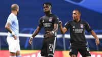 Pemain Lyon, Maxwel Cornet, melakukan selebrasi usai mencetak gol ke gawang Manchester City di perempat final Liga Champions di Stadion Jose Alvalade, Sabtu (15/8/2020). Lyon menang 3-1 atas Manchester City. (Franck Fife/Pool/via AP)