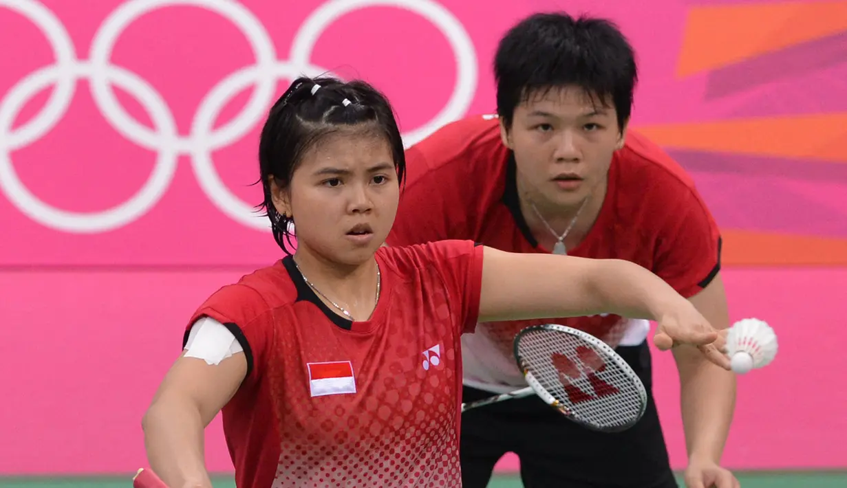 Pertama kali tampil di Olimpiade adalah saat Olimpiade London 2012, Inggris. Greysia Polii saat itu berpasangan dengan Meiliana Jauhari yang mulai dipasangkan sejak Januari 2010. (Foto: AFP/Adek Berry)