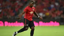 Paul Pogba diyakini bertahan di MU, tapi Real Madrid terus menggoda (Roslan RAHMAN / AFP)