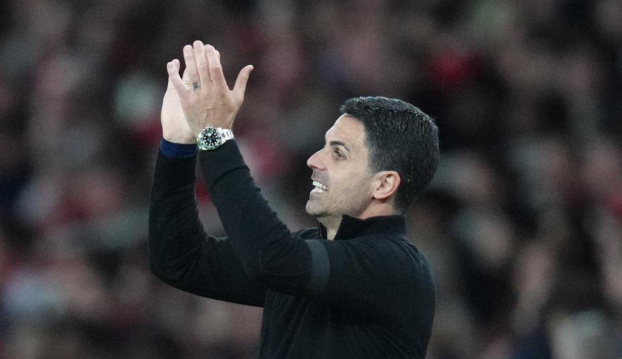 Wajah bahagia terpancar dari Mikel Arteta setelah Arsenal berhasil meraih kemenangan penting saat menjamu Burnley dalam lanjutan Premier League 2025/2026. Bermain di Emirates Stadium, Selasa (19/5/2026) dini hari WIB, The Gunners menang tipis 1-0 lewat gol Kai Havertz. (AP Photo/Kirsty Wigglesworth)