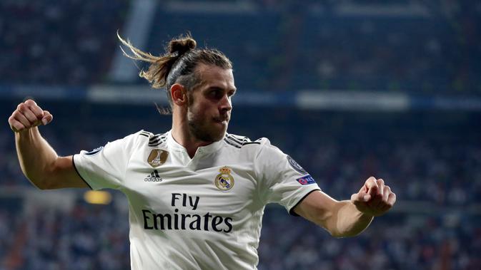 Selebrasi gelandang Real Madrid, Gareth Bale usai mencetak gol ke gawang AS Roma pada pertandingan Grup G Liga Champions di Stadion Santiago Bernabeu, Madrid, Spanyol, Rabu (19/9). Madrid membantai Roma 3-0. (AP Photo/Manu Fernandez)
