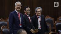 Calon presiden dan calon wakil presiden nomor urut 3 Ganjar Pranowo dan Mahfud MD hadir dalam sidang putusan perkara Perselisihan Hasil Pemilihan Umum (PHPU) atau putusan sidang sengketa Pilpres 2024 di Mahkamah Konstitusi (MK), Senin (22/4/2024). (Liputan6.com/Angga Yuniar)