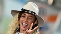 "Saat Miley menghapus semua foto di Instagram, ia tahu orang-orang akan bertanya alasannya," ujar seorang sumber. (JEWEL SAMAD  AFP)
