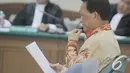 Didik Purnomo menjalani sidang perdana di Pengadilan Tipikor, Jakarta, Kamis (11/12/2014). (Liputan6.com/Andrian M Tunay)