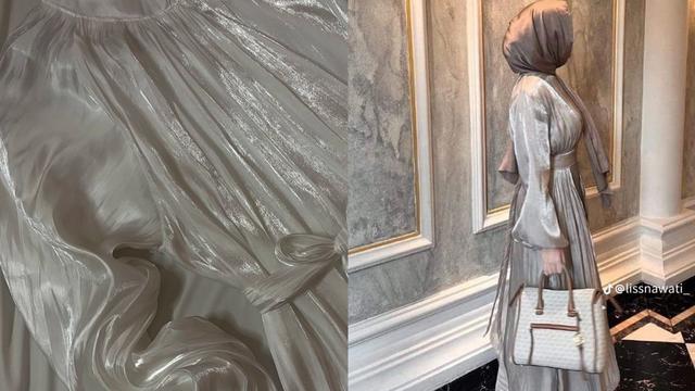 Shimmer dress dengan warna netran untuk tren baju lebaran 2024.
