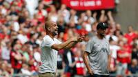 Manajer Manchester City, Pep Guardiola, mengaku puas dengan pertandingan kontra Liverpool pada laga Community Shield 2019, di Stadion Wembley, Minggu (4/8/2019). (AFP/Ian Kington)