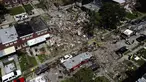 Puing-puing menutupi tanah usai ledakan di Baltimore, Maryland, Amerika Serikat, Senin (10/8/2020). Ledakan yang diduga akibat kebocoran gas tersebut menewaskan seorang wanita dan melukai enam orang lainnya. (AP Photo/Julio Cortez)