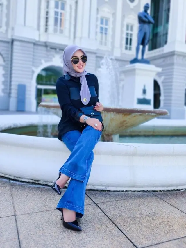 Outfit Syahrini kembali ke Singapura