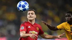 Diogo Dalot mampu tunjukkan peningkatan setelah dirinya dipinjamkan oleh Manchester United ke AC Milan. Dirinya hanya menjadi pemain pengganti di laga pramusim melawan Everton, namun mampu berikan penampilan yang apik dan gol indah lewat tandukan kepalanya. (Foto: AFP/Fabrice Coffrini)