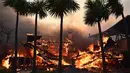 Sedikitnya lima orang tewas dalam kebakaran hutan hebat yang menghanguskan sejumlah kawasan di sekitar Los Angeles, kata para pejabat pada 8 Januari 2025.  (AGUSTIN PAULLIER/AFP)