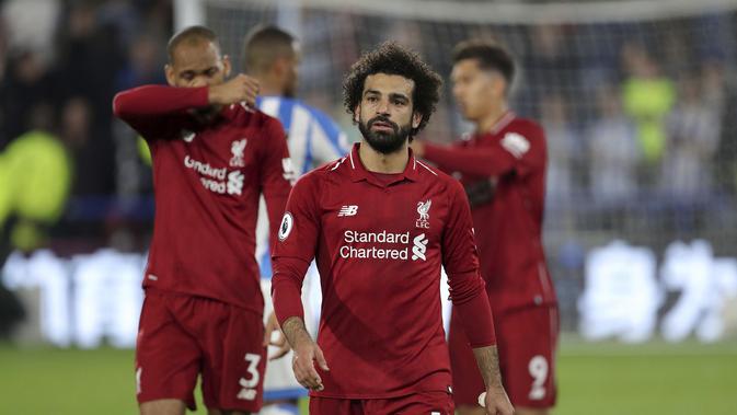 Mohamed Salah mencetak gol kemenangan Liverpool atas Huddersfield Town pada pekan kesembilan Liga Inggris 2018-19, Sabtu (20/10/2018). (Richard Sellers/PA via AP)