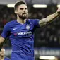 Striker Chelsea, Oliver Giroud, melakukan selebrasi usai membobol gawang PAOK Thessaloniki pada laga Liga Europa di Stadion Stamford Bridge, Kamis (29/11). Chelsea menang 4-0 atas PAOK Thessaloniki. (AP/Matt Dunham)