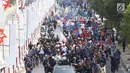 Suasana acara Torch Relay Asian Games 2018 di kawasan TMII, Jakarta Timur, Rabu (15/8).  Sementara pada Kamis (16/8), obor akan mengelilingi wilayah Jakpus, Jakbar dan Jakarta Utara. (Liputan6.com/Immanuel Antonius)