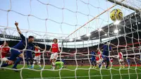 Gelandang Chelsea, Jorginho, melakukan selebrasi usai mencetak gol ke gawang Arsenal pada lanjutan Liga Inggris di Emirates Stadium, Minggu (29/12/2019). The Blues –julukan Chelsea, mampu menutup laga dengan skor akhir 2-1 di kandang Arsenal. (AP Photo/Ian Walton)