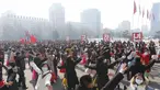 Siswa menari selama perayaan ulang tahun ke-74 berdirinya Tentara Rakyat Korea di alun-alun Stadion Indoor Pyongyang di Pyongyang, Korea Utara, Selasa (8/2/2022).  (AP Photo/Jon Chol Jin)