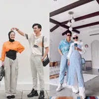 Kala berlibur ke luar negeri, Dinda &amp; Rey tampil eye catching dengan outfit nuansa oranye. (Instagram/rey_mbayang).