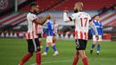 Striker Sheffield United, David McGoldrick (kanan) melakukan selebrasi usai mencetak gol ke gawang Brighton and Hove Albion dalam laga lanjutan Liga Inggris 2020/2021 pekan ke-33 di Bramall Lane, Sheffield, Sabtu (24/4/2021). Sheffield United menang 1-0 atas Brighton. (AP/Michael Regan/Pool)