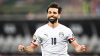 Mohamed Salah berhasil menjadi penentu kemenangan Mesir saat menumbangkan Pantai Gading di babak 16 besar Piala Afrika 2021 yang berlangsung di Stade Omnisport de Douala, Rabu (26/1/2022) malam WIB. (AFP/Charly Triballeau)