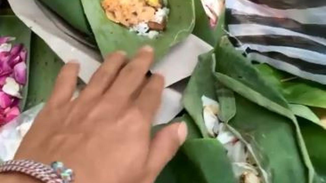 Viral pemuda makan sesajen di kuburan, apa hukum makan sesaji dalam perspektif Islam? (Foto: Tangkapan Layar IG @memomedsos)