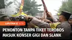 Penonton yang tidak memiliki tiket memaksa masuk untuk menyaksikan konser Slank dan Gigi di Pantai Alam Indah Kota Tegal, Jawa Tengah, Sabtu (15/10) petang. Sempat terjadi kericuhan antara polisi dan penonton. Polisi akhirnya mengizinkan para penggem...