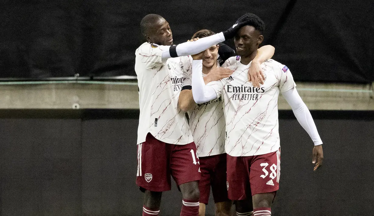 Striker Arsenal, Folarin Balogun, merayakan gol yang dicetaknya ke gawang Molde pada laga lanjutan Liga Europa di Aker Stadion, Jumat (27/11/2020) dini hari WIB. Arsenal menang 3-0 atas Molde. (AFP/Svein Ove Ekornesvag/NTB)