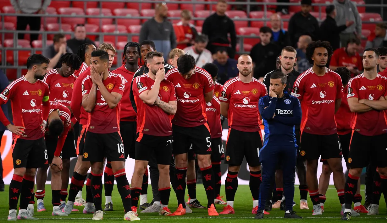 Ekspresi para pemain Manchester United atas kekalahan mereka di final Liga Europa musim 2024/2025 melawan Tottenham Hotspur di stadion San Mames, Bilbao pada 21 Mei 2025 waktu setempat atau Kamis (22/5) dini hari WIB. (Josep LAGO/AFP)