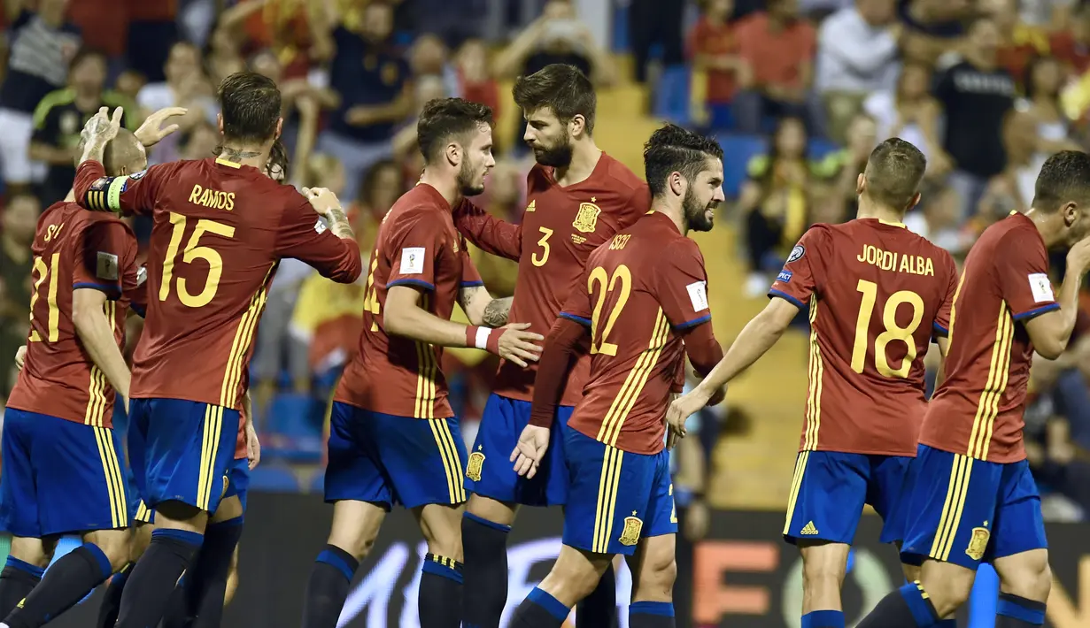 Spanyol lolos ke putaran fina Piala Dunia 2018 sebagai juara grup G dengan raihan 28 poin. Spanyol unggul lima poin dari Italia di peringkat kedua. (AFP/Jose Jordan)