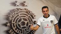 Xavi Hernandez ingin menjadi pelatih Barcelona di masa depan. (Liputan6.com/KARIM JAAFAR / AL-WATAN - DOHA / AFP)
