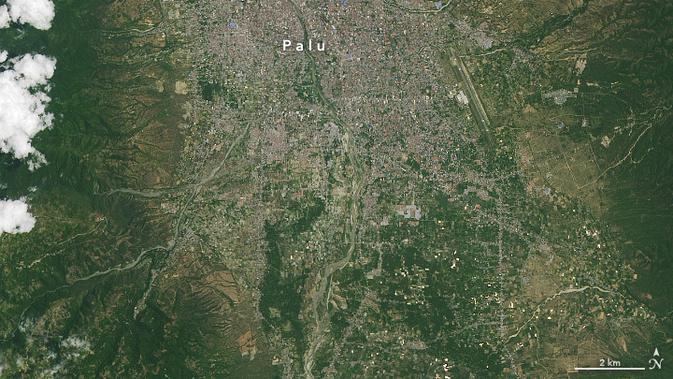 Foto yang diabadikan oleh satelit NASA, Landsat 8, terkait tsunami Palu pada 23 September 2018. (Dokumentasi NASA)