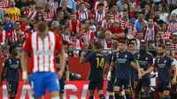 Pemain Real Madrid merayakan gol yang dicetak Joselu ke gawang Girona dalam laga jornda delapan La Liga Spanyol di Estadi Municipal de Montilivi, Sabtu (30/9/2023). Real Madrid menang 3-0 dalam laga ini. (AP Photo/Joan Monfort)