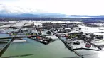 Air hujan membanjiri Desa Obot, sekitar 100 kilometer (60 mil) barat laut Tirana, Albania, Senin (11/1/2021). Hujan deras dan salju selama beberapa hari terakhir telah membanjiri banyak kawasan di Albania. (AP Photo/Hektor Pustina)