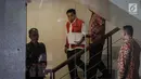 Tersangka Kasus Korupsi e-KTP Setya Novanto usai menjalani pemeriksaan di gedung KPK, Jakarta, Jumat (22/12). Setnov diperiksa sebagai saksi untuk tersangka Direktur Utama PT Quadra Solution Anang Sugiana Sudiharjo (ASS). (Liputan6.com/Faizal Fanani)