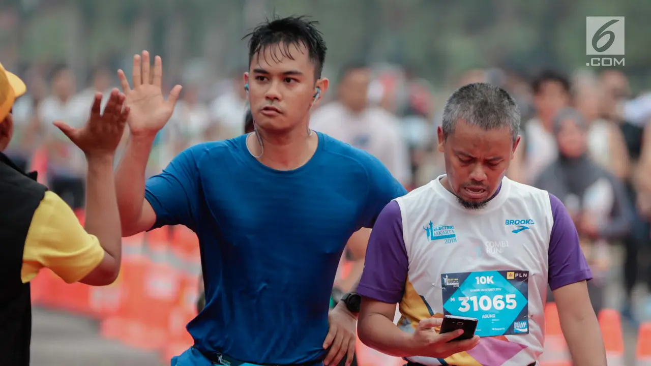 Ekspresi Pelari Jakarta Marahthon saat Mencapai Garis Finish