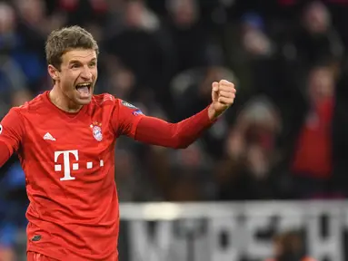 Pemain Bayern Munchen Thomas Mueller merayakan golnya ke gawang Tottenham Hotspur pada pertandingan Grup B Liga Champions di Munich, Jerman, Rabu (11/12/2019). Munchen mengalahkan ekuk Tottenham 3-1. (Christof STACHE/AFP)